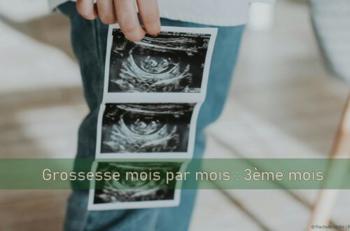 femme tient échographie de son bébé